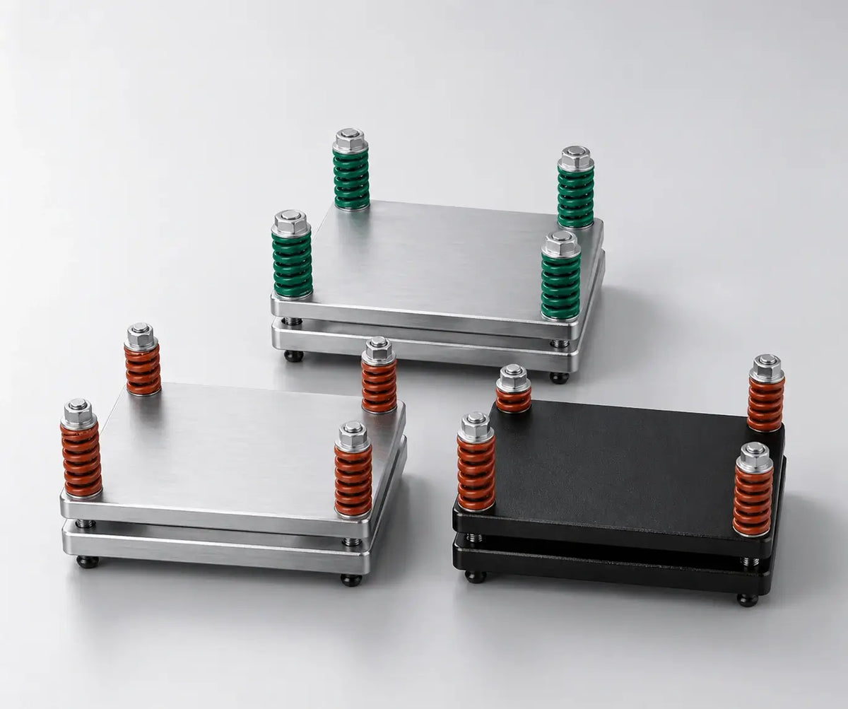Three spring-loaded pouch cell test fixtures for battery laboratory testing